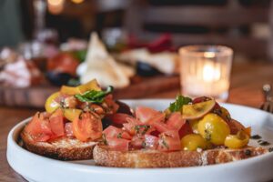 A classic bruschetta with Altamura bread, extra virgin olive oil, cherry tomatoes, garlic, basil